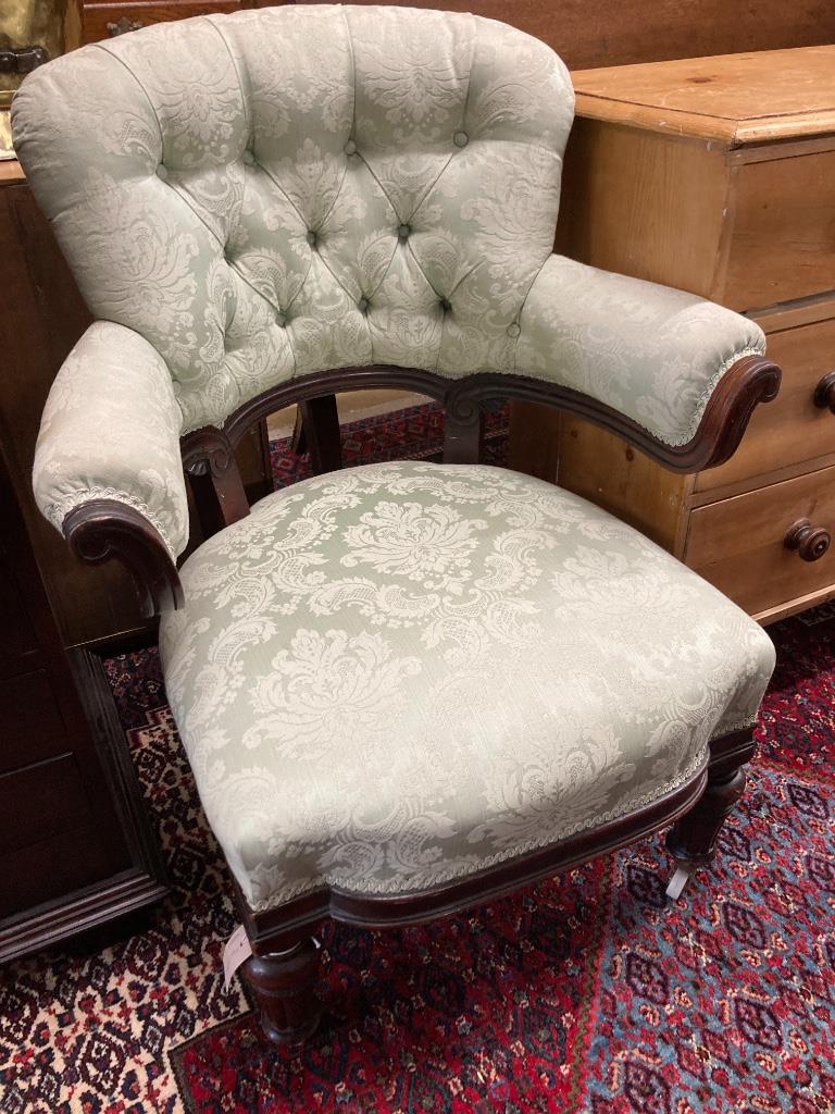 A Victorian carved mahogany upholstered armchair, width 72cm, depth 64cm, height 91cm